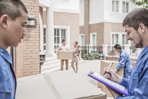 House removalists loading furniture in London street