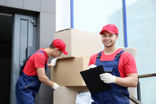 Packed boxes and labeled office equipment ready for moving
