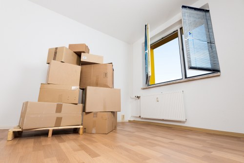 A worker preparing boxes and equipment for a safe move