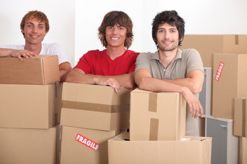 Delivery van and moving team preparing items for transport