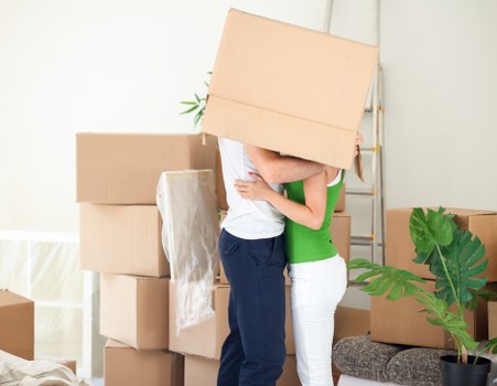 Professional movers carrying student belongings in London