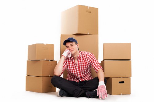 Professional movers handling furniture in a London property